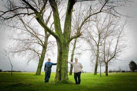 Head greens keeper Paul Bishenden and Alex Tindall by one of the trees