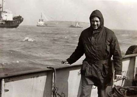 Jim Rantell with the hull of the Herald in the background