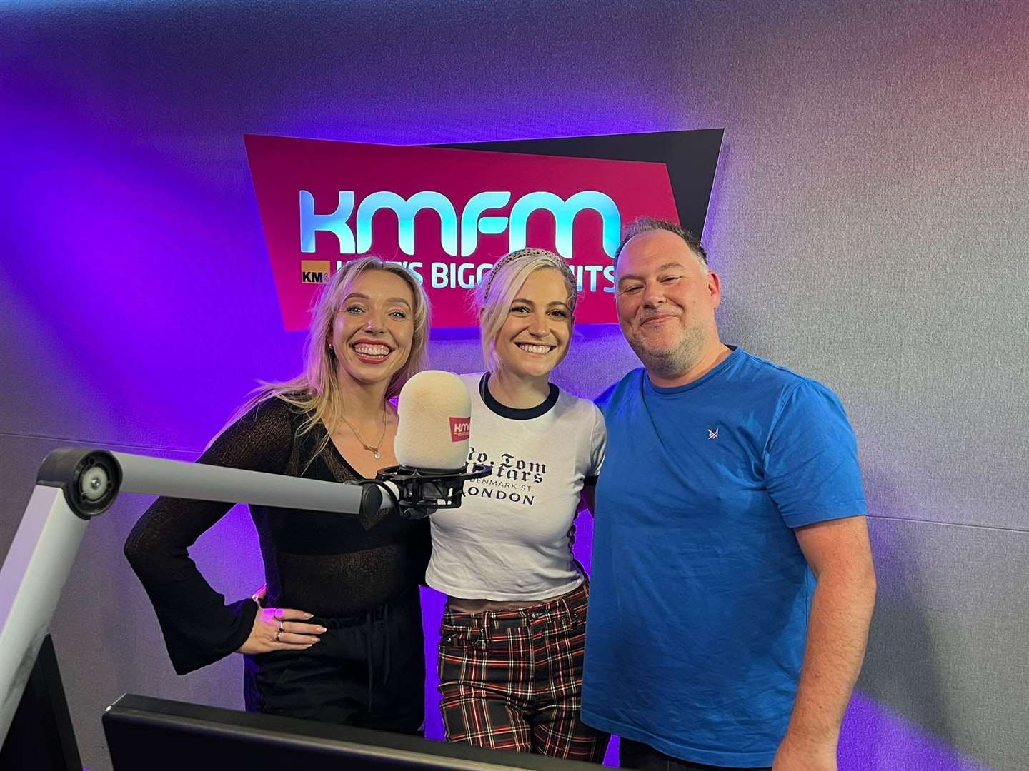 Pixie Lott with kmfm presenters Garry and Chelsea