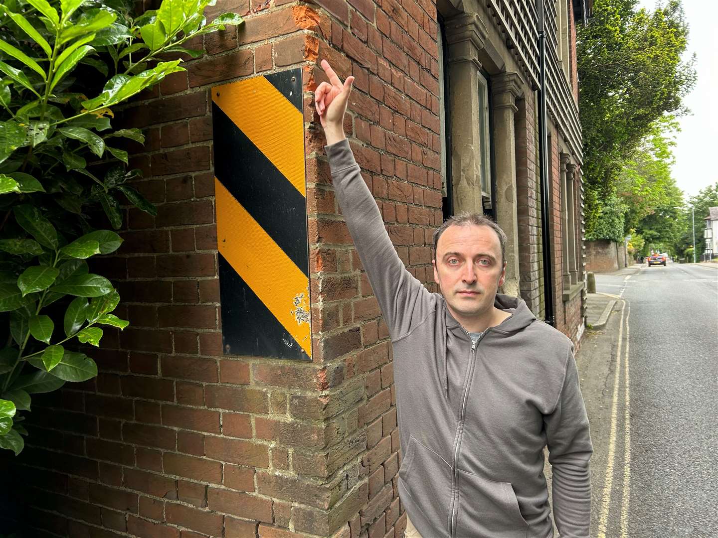 Dr Tom Nichols pointing at some of the damage caused to his home in Old Dover Road, Canterbury