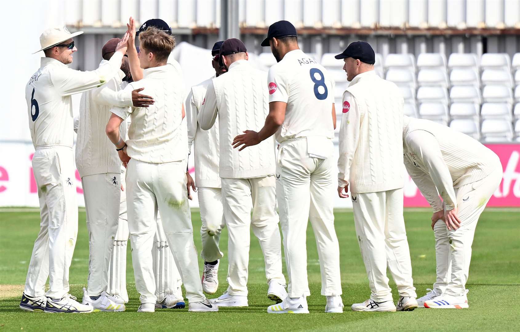 Jaydn Denly celebrates taking his maiden wicket in first-class cricket, with ‘Uncle Joe’. Picture: Barry Goodwin