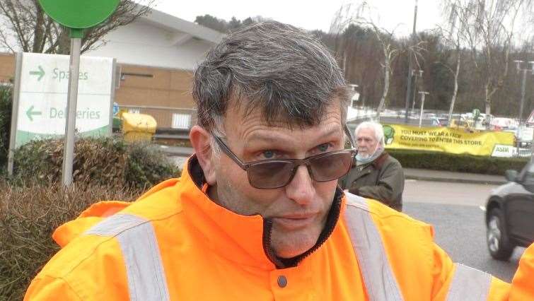 John Lawrence is protesting outside ASDA