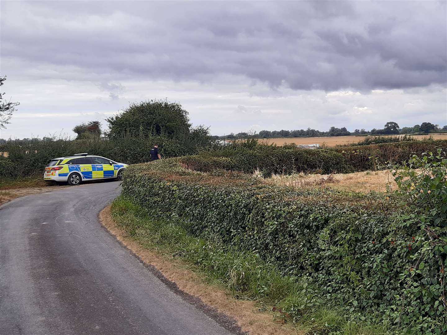 Police by the wreckage of the plane in Tar Pot Lane