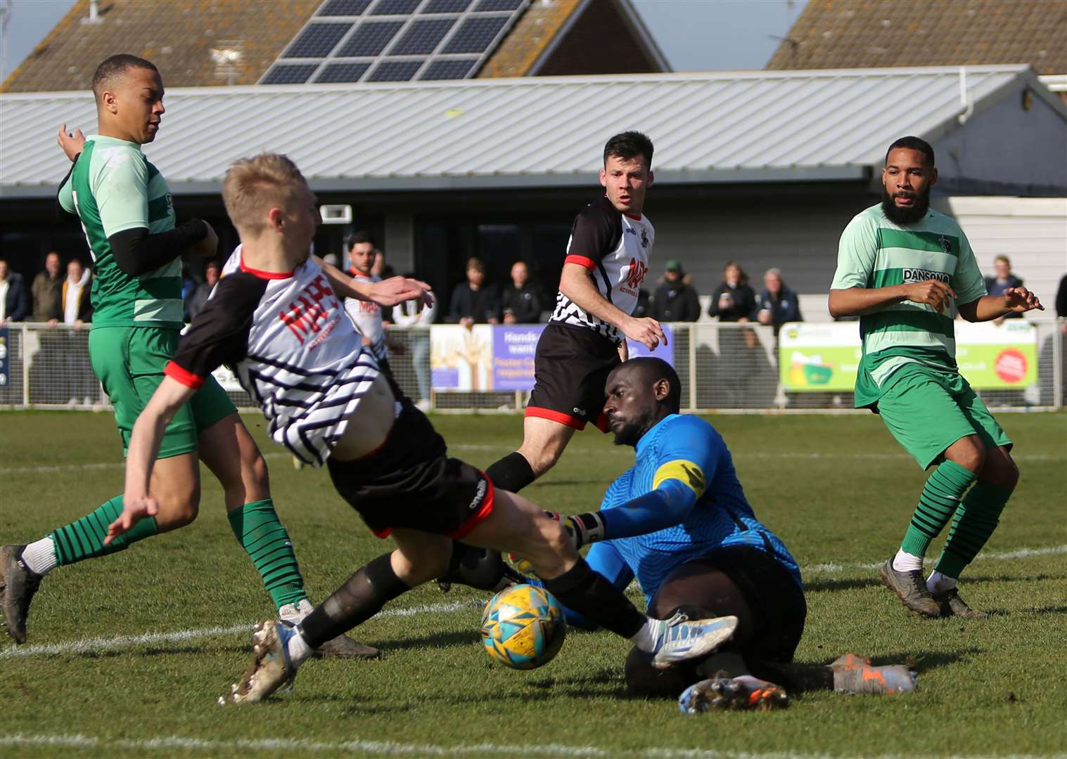 Ben Chapman's close-range effort is blocked by Welling keeper George Kamurasi. Picture: Paul Willmott