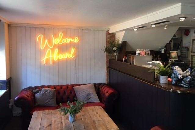 Even with white walls, the low beamed ceilings make the pub and restaurant fairly dark inside