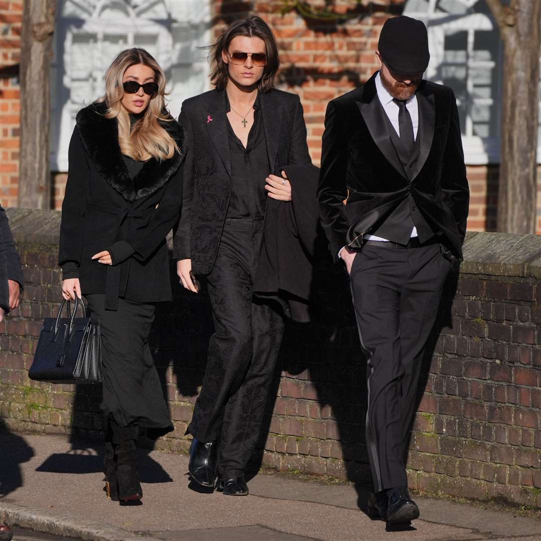 Kate Cassidy and Damian Hurley (centre) arrive for the funeral service of One Direction singer Liam Payne at St Mary’s Church in Amersham, Buckinghamshire (Jonathan Brady/PA)