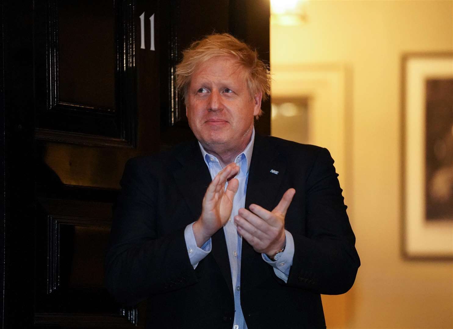 Mr Johnson clapping outside 11 Downing Street in London to salute local heroes on April 2 (Pippa Fowles/Crown Copyright/10 Downing Street/PA)