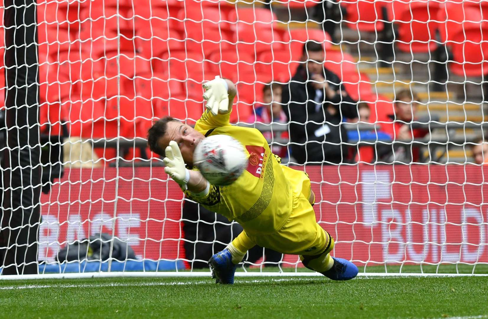 Andy Walker is beaten by Jake Baxter's penalty Picture: Keith Gillard