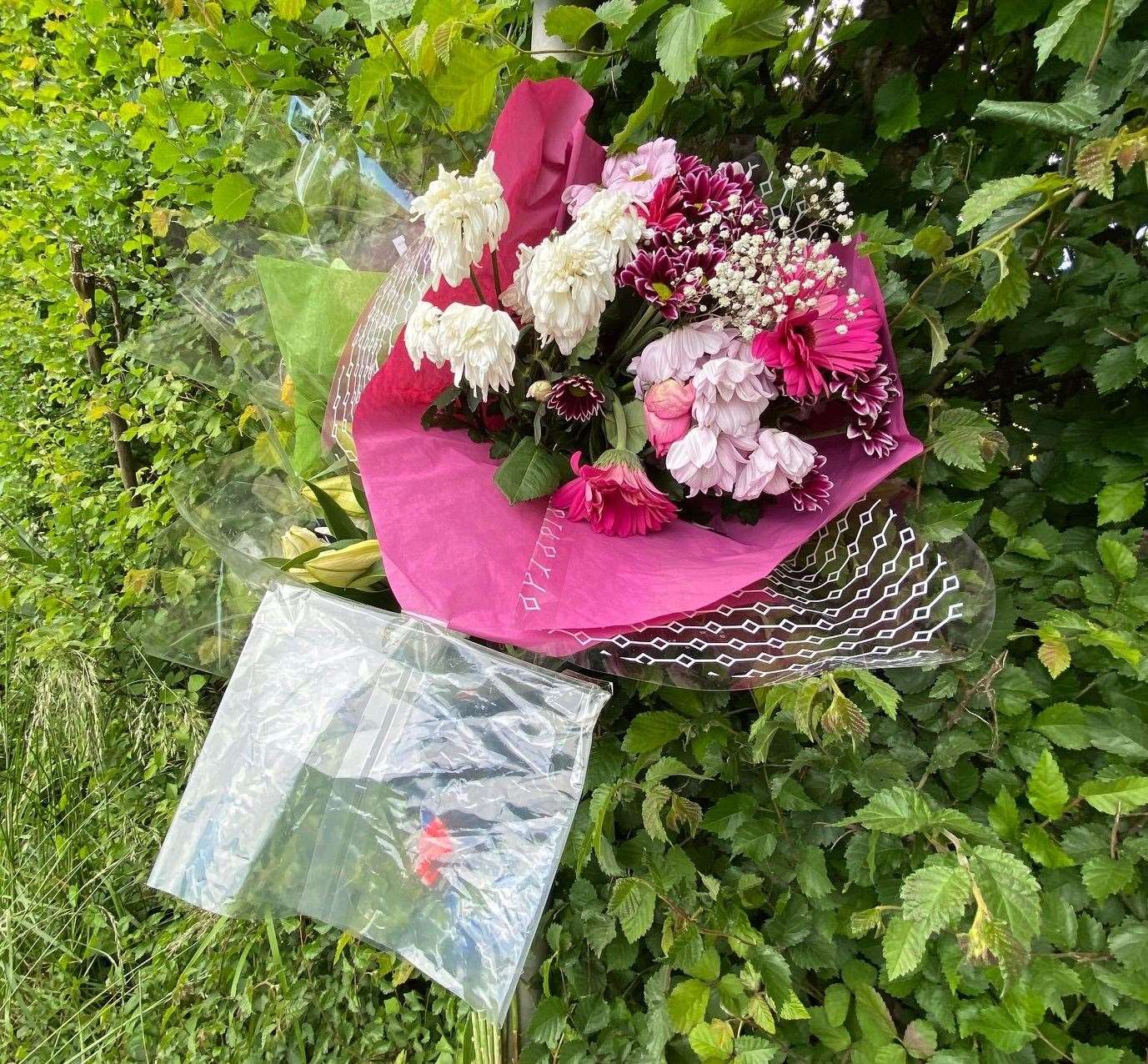 Flowers at the scene. Picture: Barry Goodwin