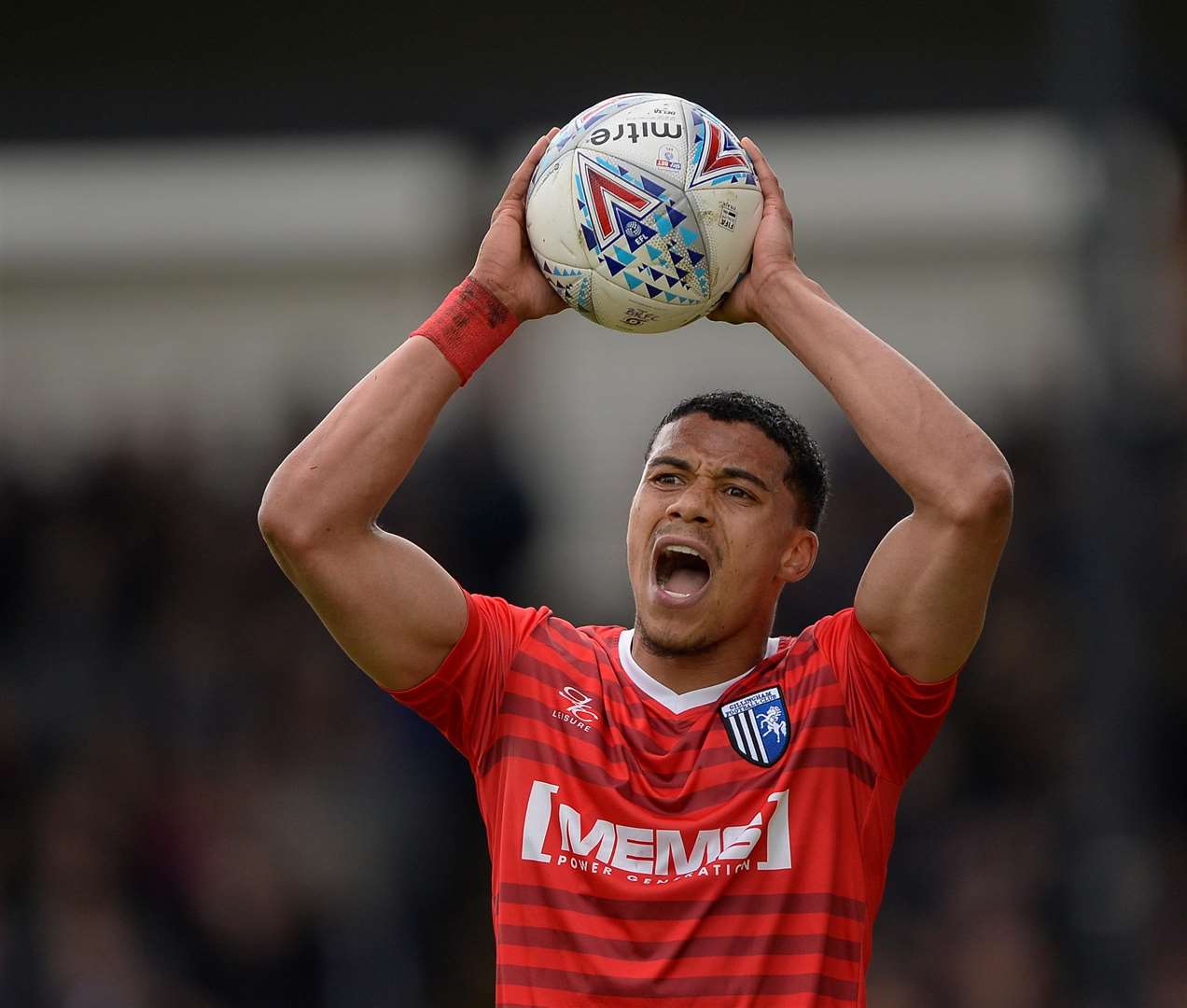 Gillingham's Bradley Garmston takes a throw Picture: Ady Kerry