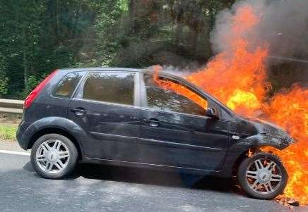 The car on fire at Detling Hill. Picture: @sophiehipwell