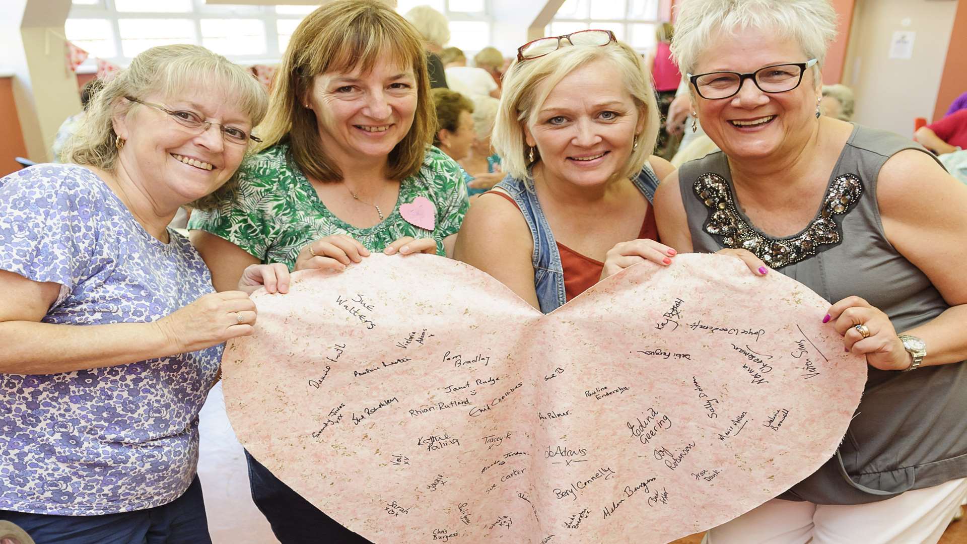 From left, with a signed heart and the hopper the group hope to fill, Janet Rudge, Sue Roughley, Tracey Kindred and Edina Geering