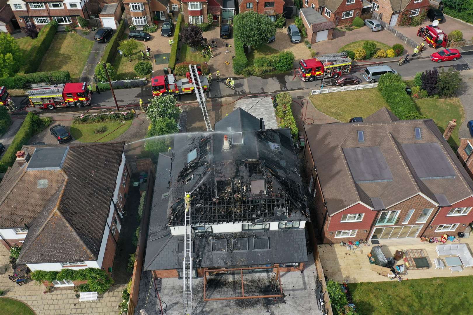 Firefighters tackling the blaze in Old Hadlow Road, Tonbridge. Picture: UKNIP