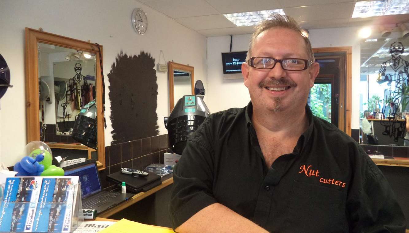 55-year-old Kevin Almond in his salon in Bank Street