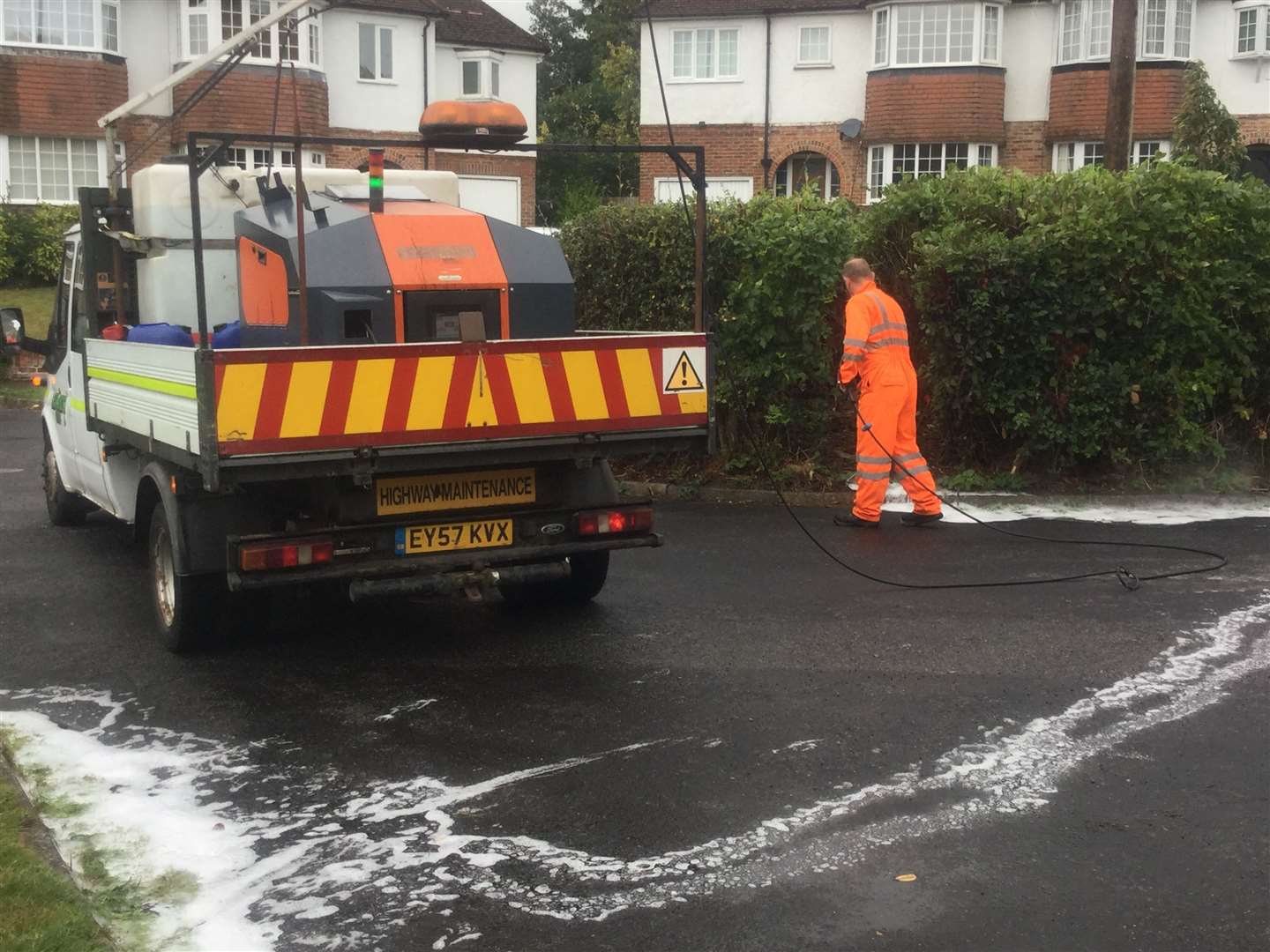 KCC highway workers using hot foam to kill weeds (18189788)