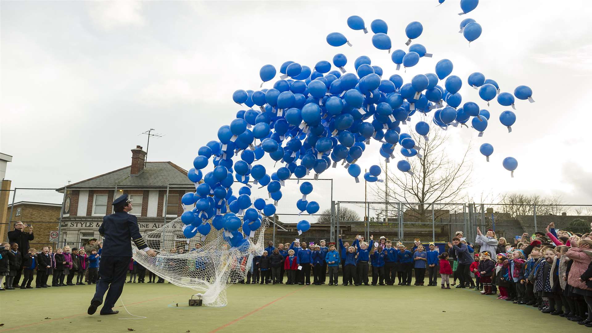 Head teacher Matt Newman sets the balloons on their way