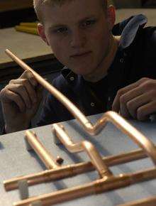 A plumbing apprentice. Library picture