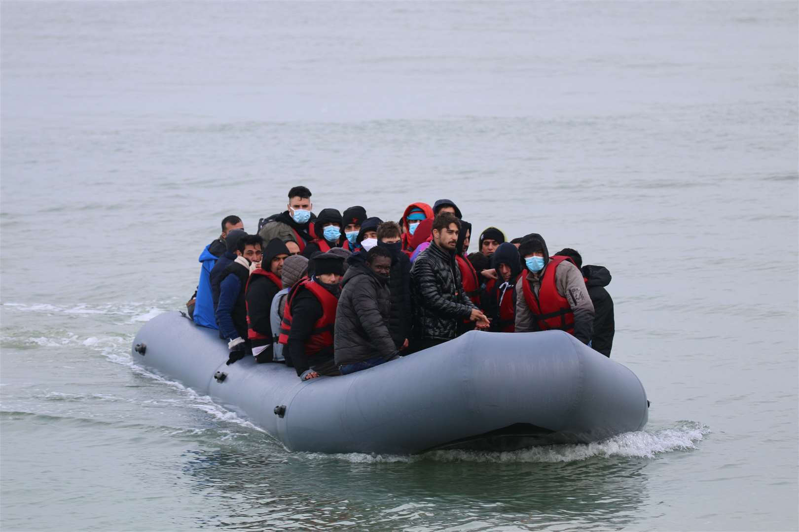 Photos show asylum seekers previously landing on the beach in Kent