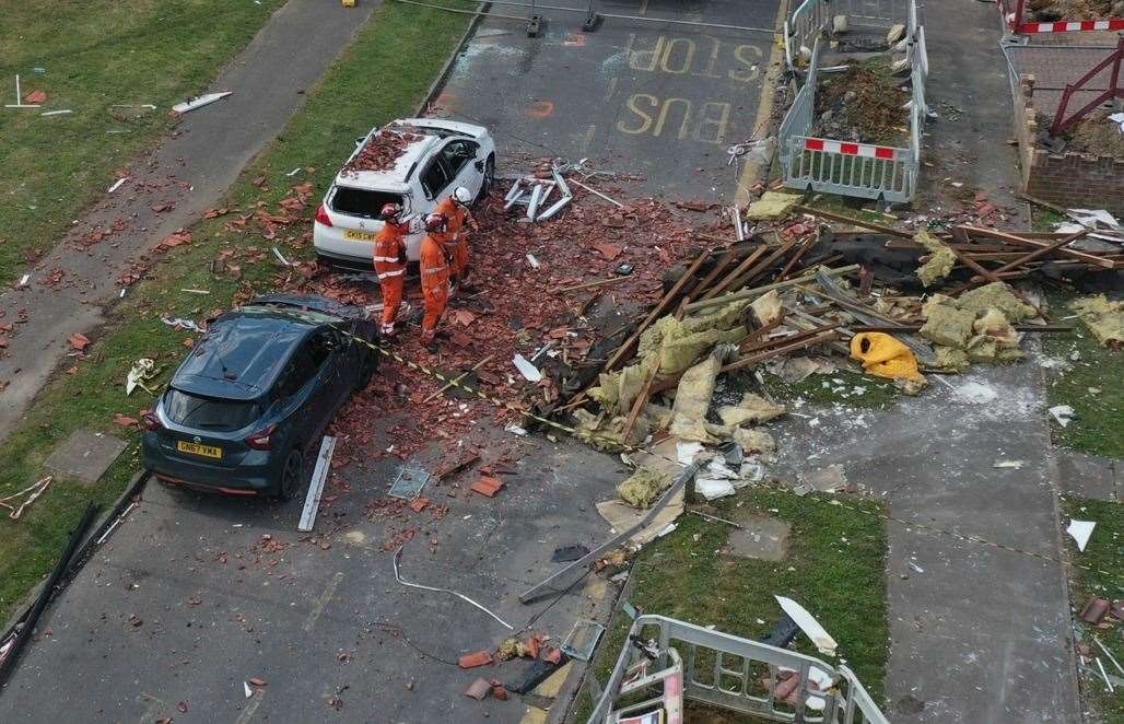 Two cars were totalled by debris