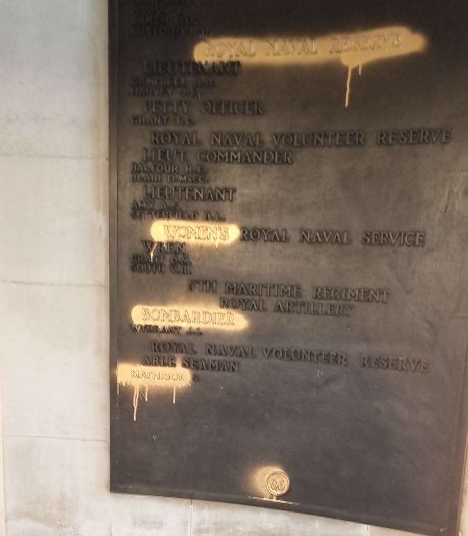 Gold spray has been daubed over war memorial