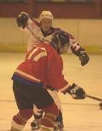 Dynamos' Sean Clement tussles with England youngster Craig Tribe (17). Picture: ANDREW WARDLEY