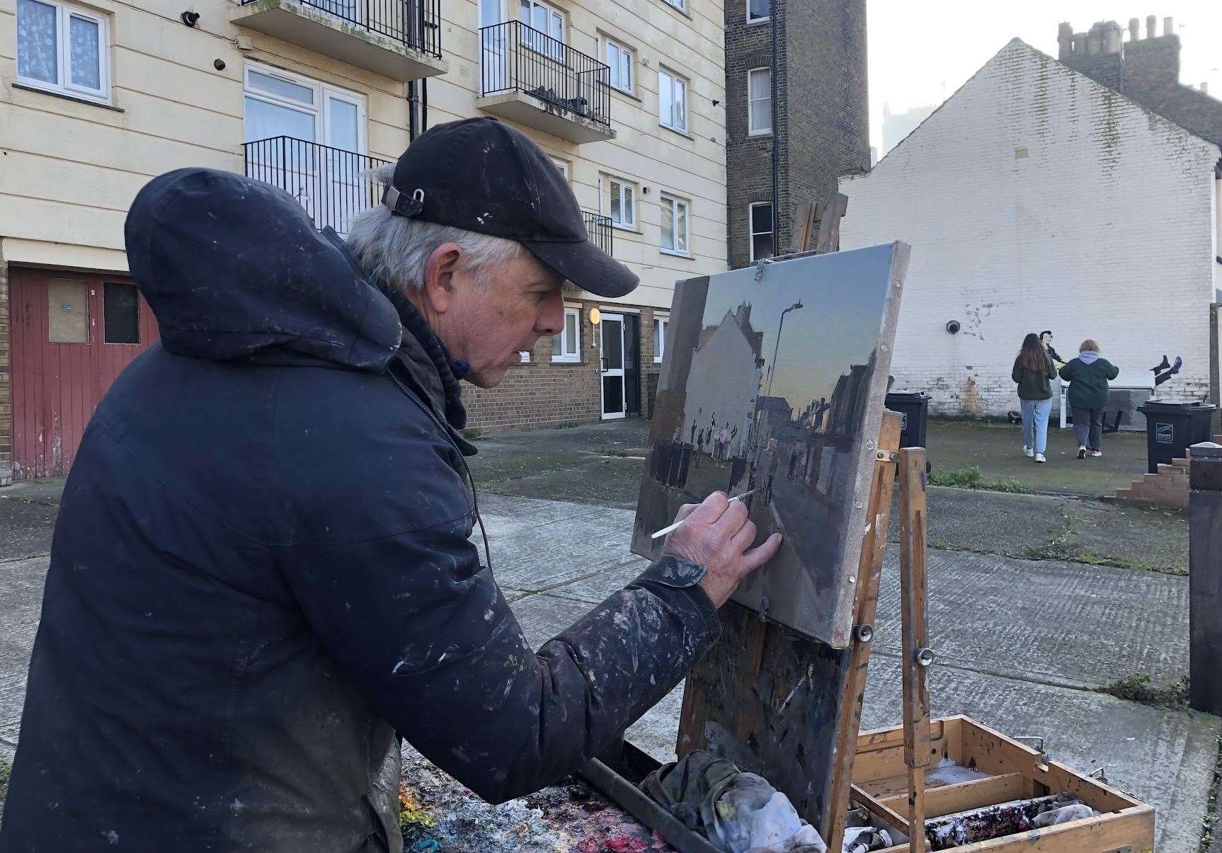 Pete Brown came from Bath to paint the wall and onlookers