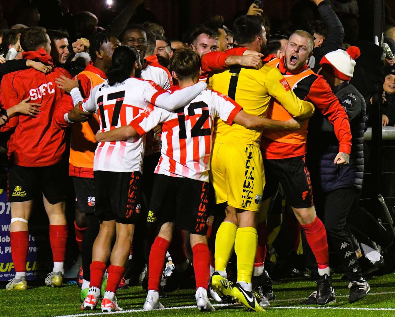 Sheppey players and fans celebrate FA Cup 1st round qualification after beating Billericay on penalties. Pic: Mark Richards