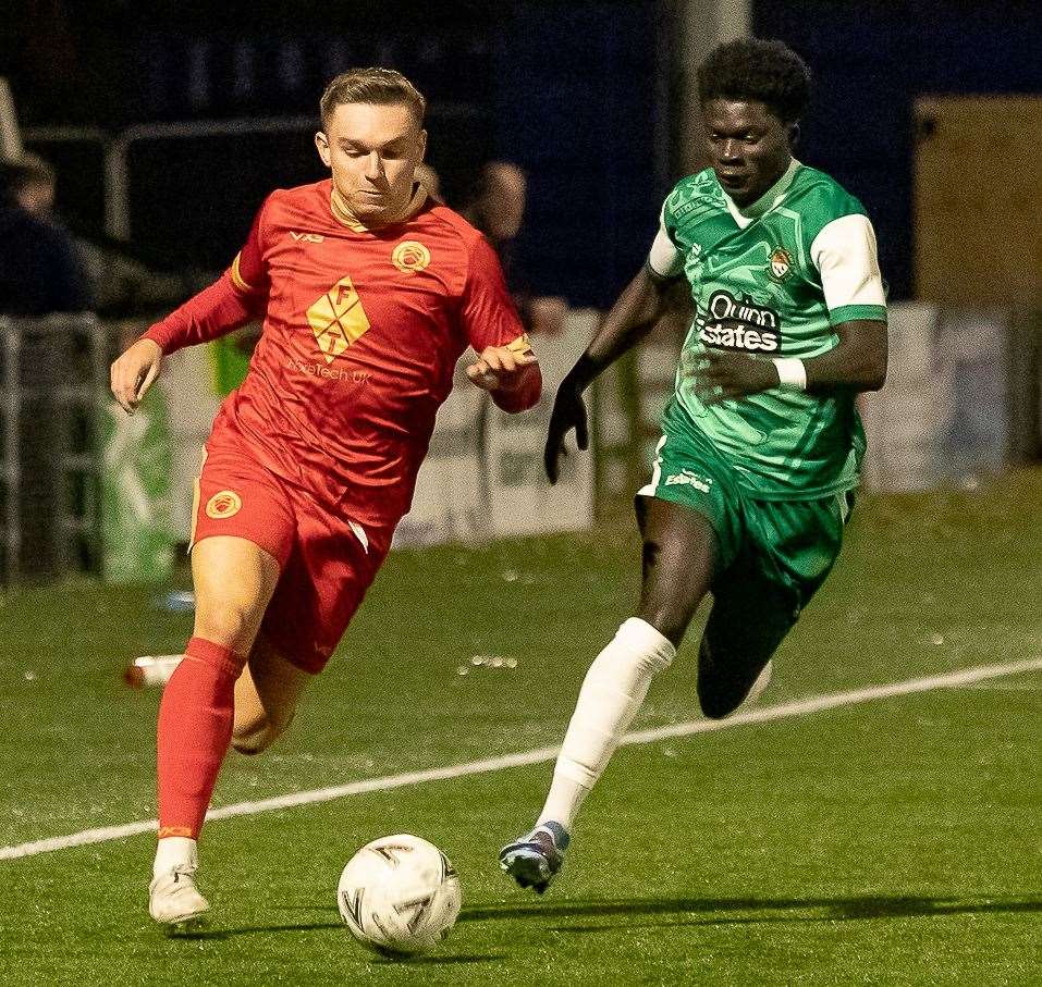 Josh Oliver, of Whitstable, races with Canterbury City player Mo Cham as the Oystermen battled to a 1-0 away Kent Senior Trophy win against Canterbury City last Friday. Picture: Les Biggs