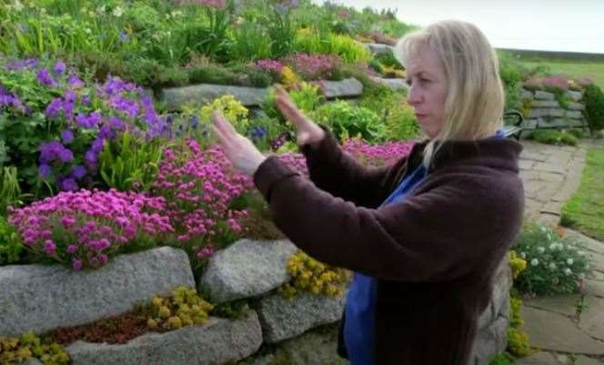 Linda Ford shows the pink seathrift which was moved around at the beginning to allow space for more planting. Picture BBC