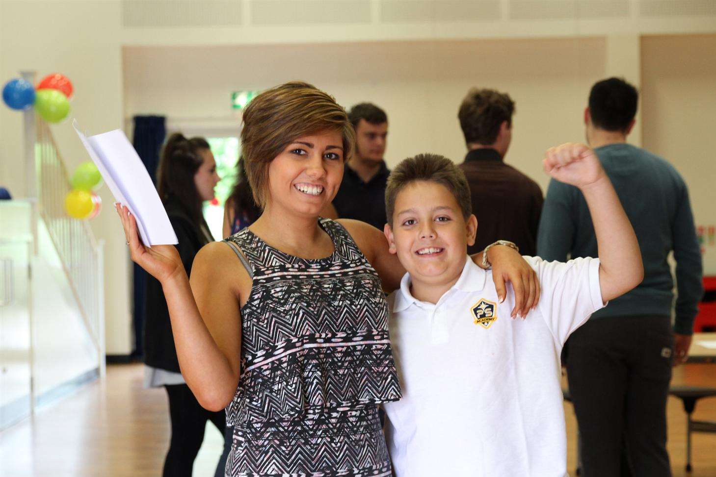 A-level student Lucy Dapkus celebrates getting her results with younger brother Lee Dapkus at Aylesford School - Sports College.