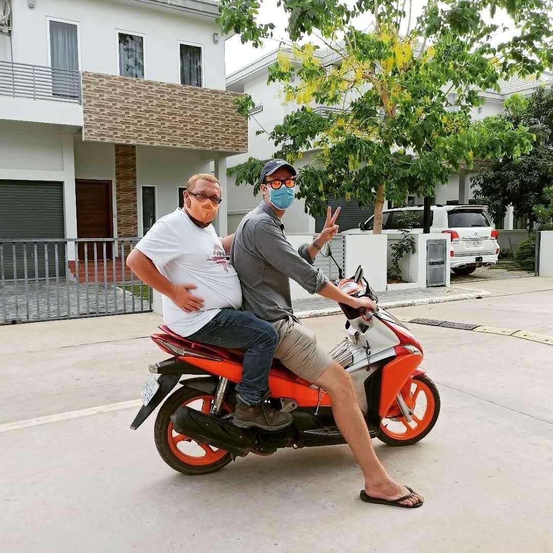 Gareth Johnson, left, with friend and colleague Rowan Beard - the Cambodian authorities say everyone must wear masks on the streets