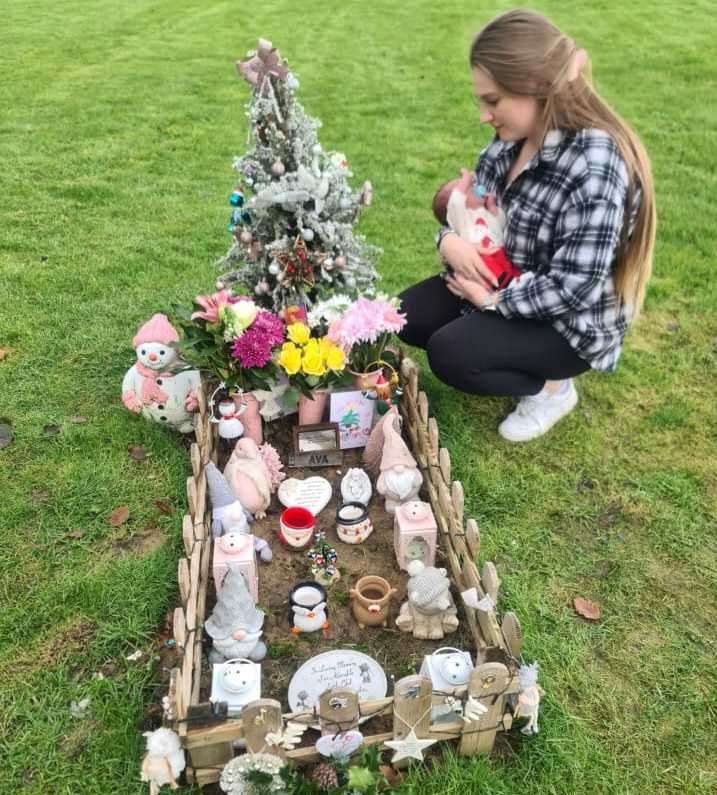 Abigail White at Ava-Grace Edward's grave at St Peter's and St Paul's Church in Boughton-under-Blean. Picture: Abigail White