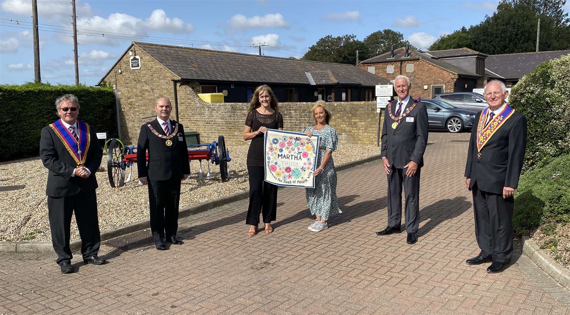 Martha Trust's Julie Gaylor and Kerry Banks receive the grant from the Mark Benevolent Fund for Freemasonry