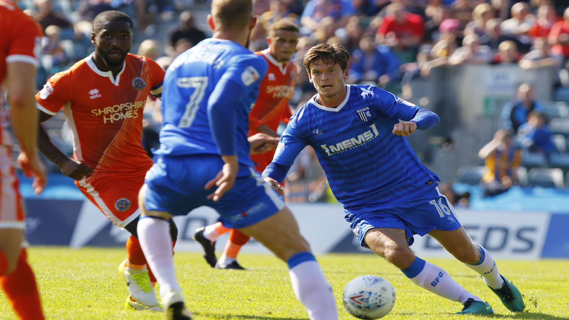 Billy Bingham works his way through the Shrewsbury midfield Picture: Andy Jones