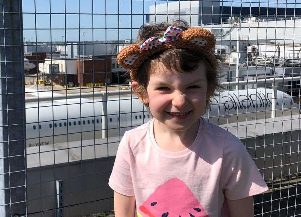 Nellie-Rose looking excited at Heathrow Airport before boarding the plane