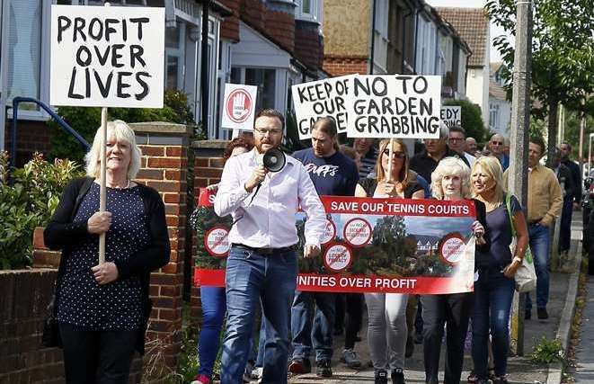 People displayed banners and posters as they marched down Glebe Road