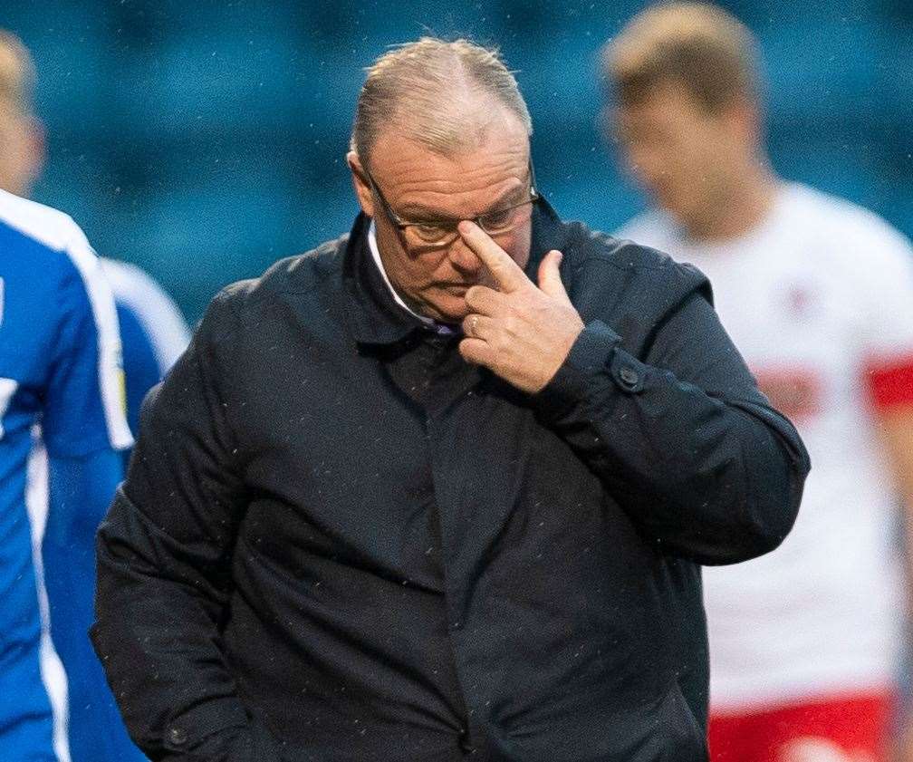 Boss Steve Evans ponders Gillingham's display on Saturday Picture: Ady Kerry