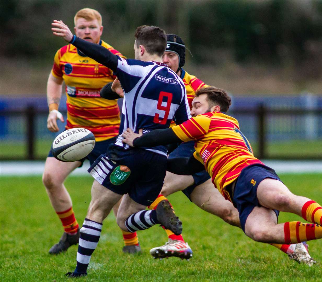 Medway's Owen Church-Mills makes a tackle against Sudbury with Antony Clement watching on. Picture: Jake Miles Sports Photography