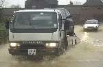 FLOODS OF TROUBLE: The scene in Maidstone Road at Nettlestead Green, near Maidstone. Picture: GRANT FALVEY