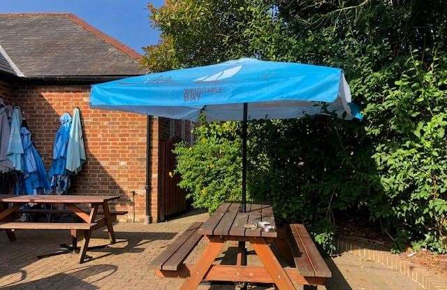 Most of the blue Whitstable Bay umbrellas were stacked at the side of the patio as people were enjoying a rare showing of sunshine