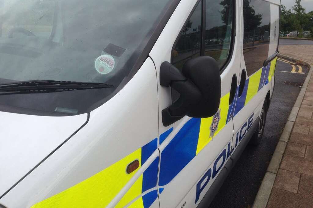 The police van parked outside the station