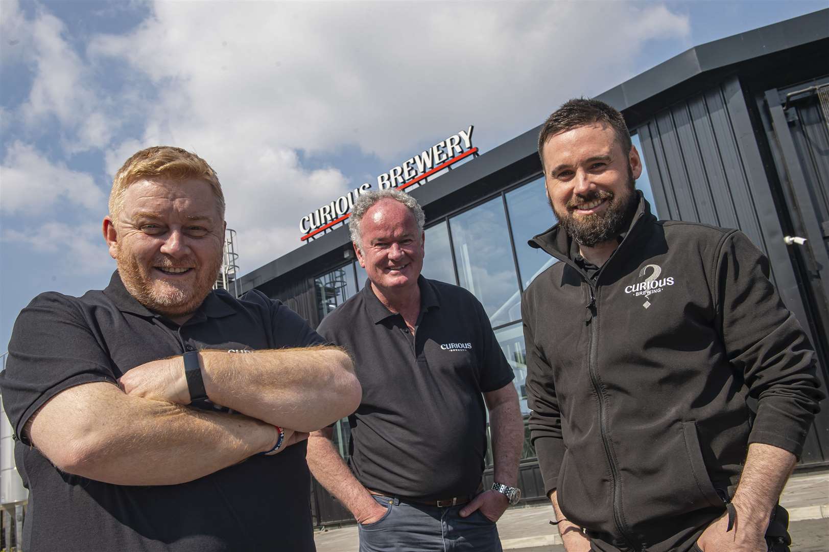 From left, Simon George, Mark Crowther and Matt Anderson, outside the Curious Brewery in Ashford