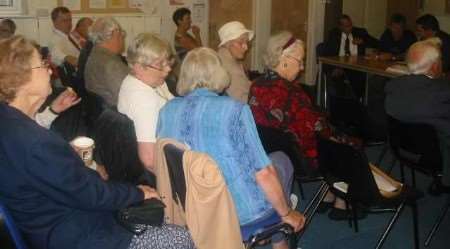 PROTEST: Old and younger people join together to protest at the meeting