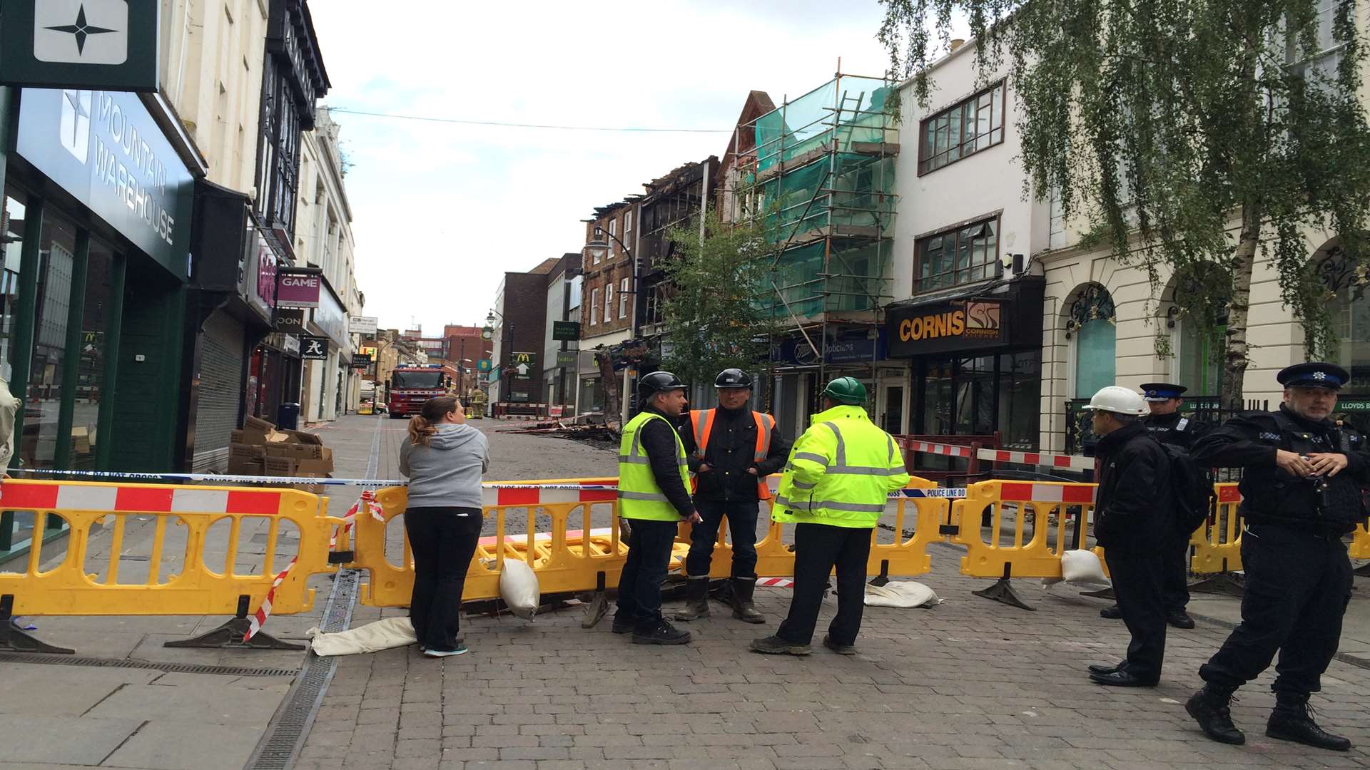 Demolition experts and architects at the scene