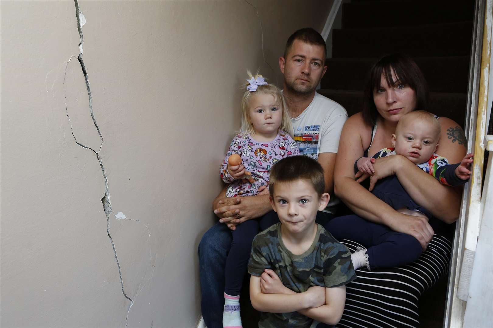 Wayne & Naomi Porter with their three youngest children Sophie, 3, Liam, 6 & Ellie,1, Picture: Andy Jones.