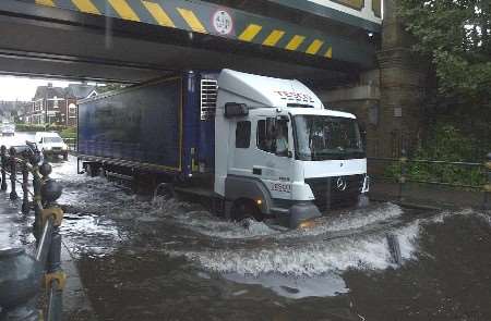 TASTE OF THINGS TO COME?: Flooding in Faversham after heavy rainfall on August 10. Picture: CHRIS DAVEY