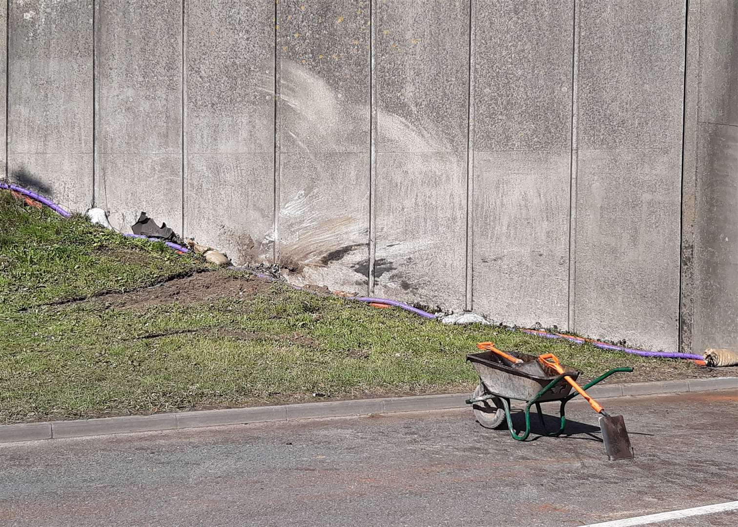 Damage to the wall of the bridge shows where the Mercedes left the road