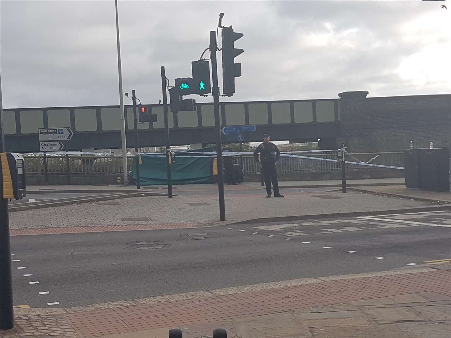 A green tarpaulin has been put up around the scene at Rochester Bridge