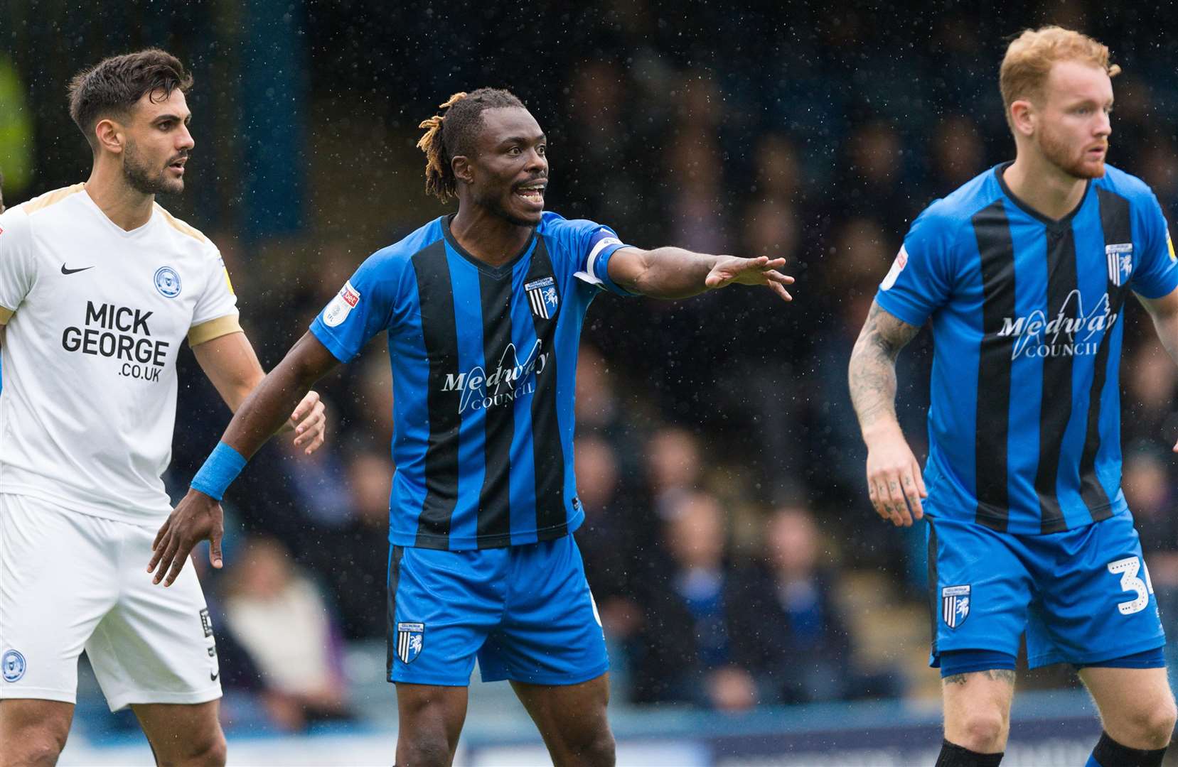 Skipper Gabriel Zakuani organises the Gills defence at a free-kick Picture: Ady Kerry