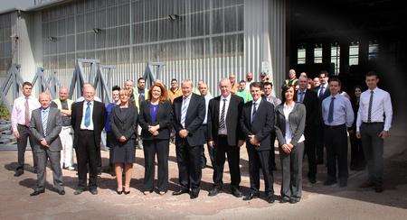 Gary Mayatt, managing director of Dartford-based Enevis, front row, fourth from right, with Powerwall workers in Scotland.